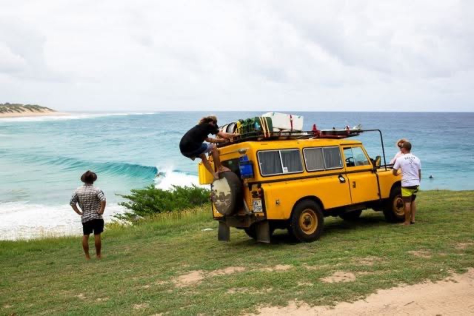The African Surfaris Land Rover parked above a pointbreak